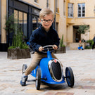 Enfant sur son Rider bleu 2-4 ans Baghera