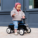 Bébé avec son porteur Racer noir Baghera